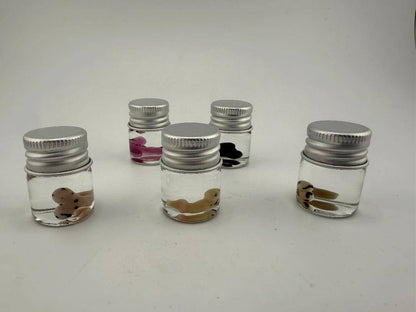 Lucky Gnome Glass Terp Pearls in jars with playful designs for dab accessories.