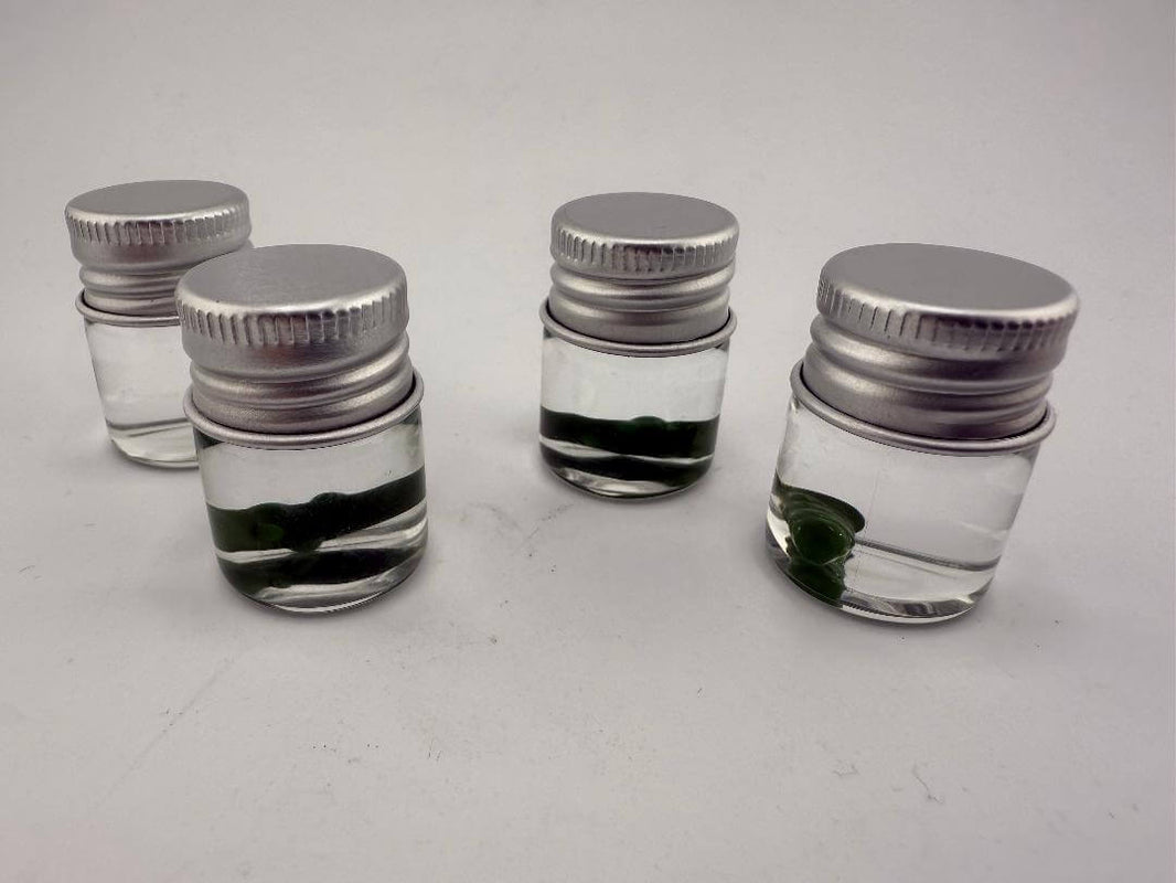 Lucky Gnome Glass Terp Pearl - Pickle in small jars, showcasing unique dab accessory for terp enthusiasts.