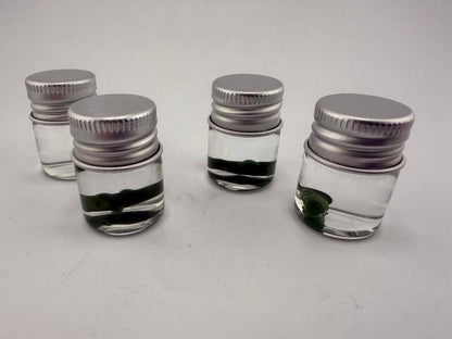 Lucky Gnome Glass Terp Pearl - Pickle in small jars, showcasing unique dab accessory for terp enthusiasts.