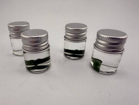 Lucky Gnome Glass Terp Pearl - Pickle in small jars, showcasing unique dab accessory for terp enthusiasts.
