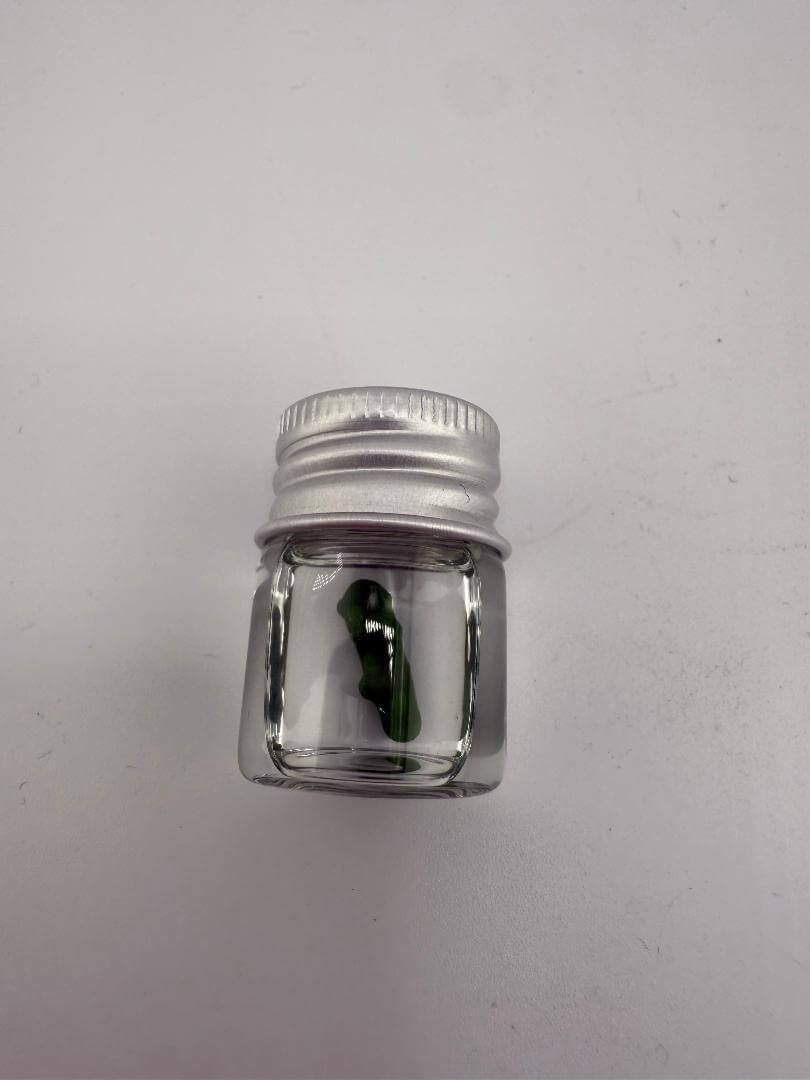 Lucky Gnome Glass Terp Pearl in jar, pickle-shaped novelty dab accessory for terp enthusiasts.