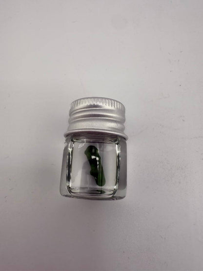 Lucky Gnome Glass Terp Pearl in jar, pickle-shaped novelty dab accessory for terp enthusiasts.