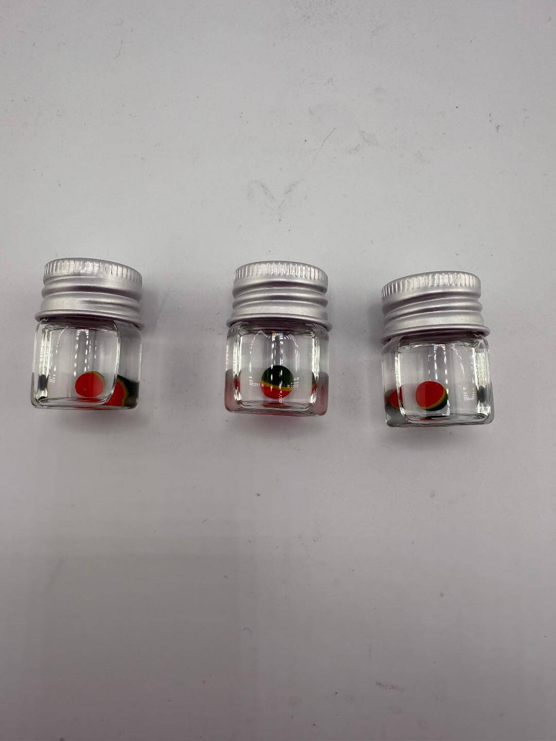 Three Lucky Gnome Glass Terp Pearl - Pokeballs in clear jars, perfect for enhancing your dabbing experience.