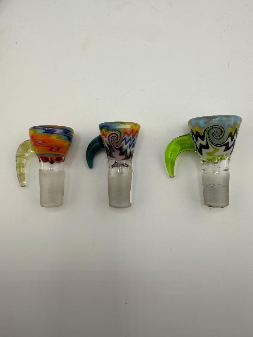 Colorful handcrafted glass bowl attachments showcasing vibrant designs and unique shapes, perfect for enhancing any setup.