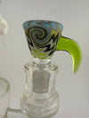 Handcrafted glass bowl with colorful swirl pattern and green handle, designed for smooth pulls and stylish use.