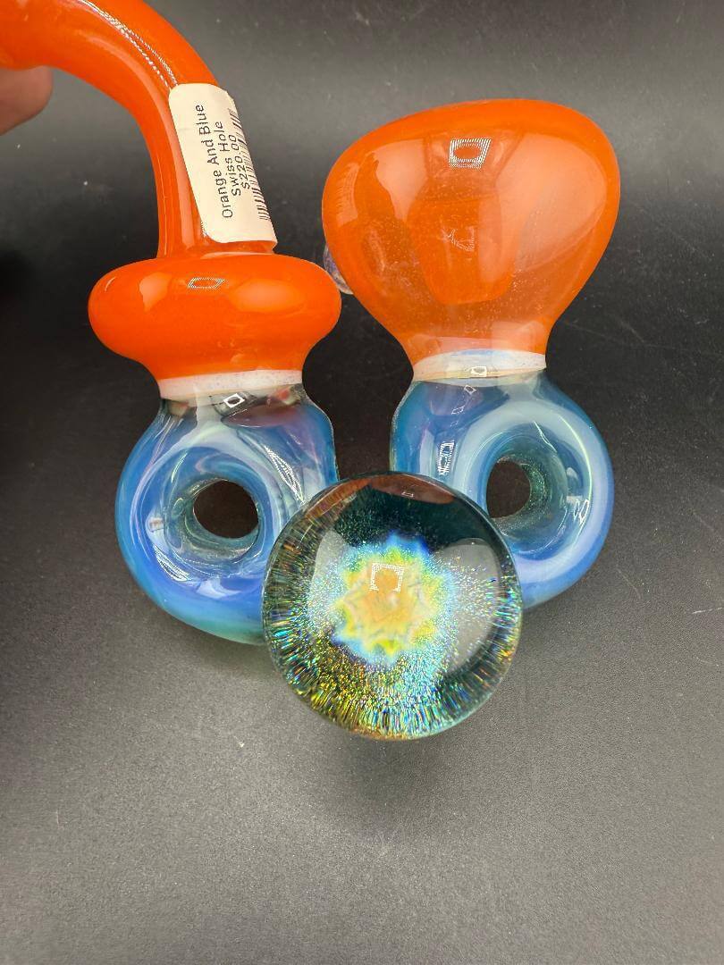 Mank Glass Sherlock Pipe - Orange And Blue Swiss Hole w/ Implosion Marble with vibrant colors and unique design.