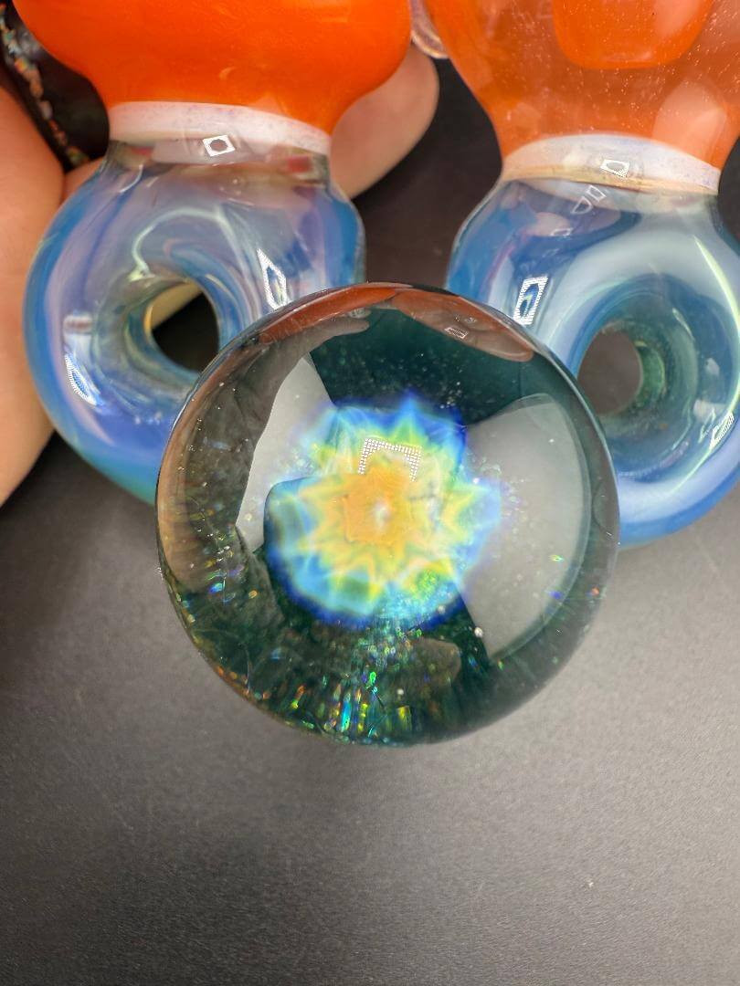 Mank Glass Sherlock Pipe - Orange And Blue Swiss Hole w/ Implosion Marble featuring vibrant colors and intricate design details.