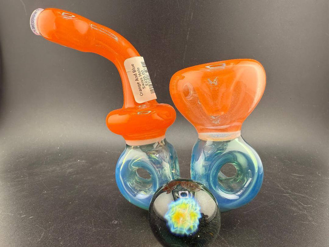 Mank Glass Sherlock Pipe - Orange And Blue Swiss Hole w/ Implosion Marble showcasing vibrant colors and intricate design.