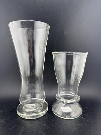 Mank Glass Simple Cup / Pilsner - Clear displayed with two clear handblown glasses on a black background.