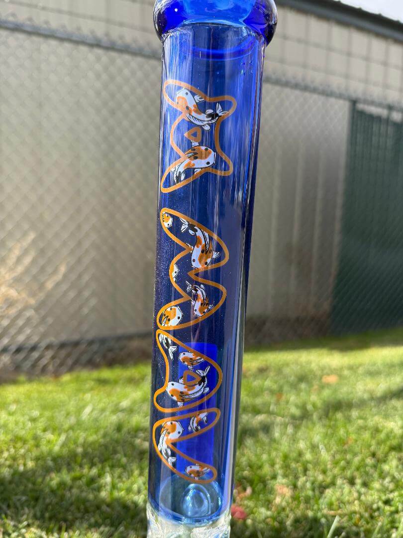 MAV Glass 18" Beaker 14mm 90° - Ink Blue Koi showcasing intricate orange koi fish design on blue glass.
