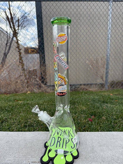 MAV Glass 18" Beaker 14mm 45° - Munchies with vibrant stickers and green accents, shown outdoors.