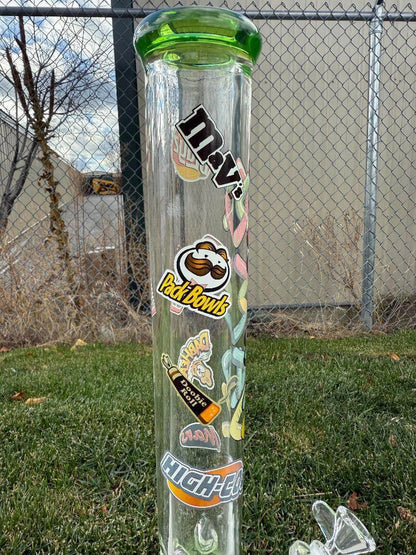 MAV Glass 18" Beaker 14mm 45° - Munchies with colorful stickers on a clear glass surface.