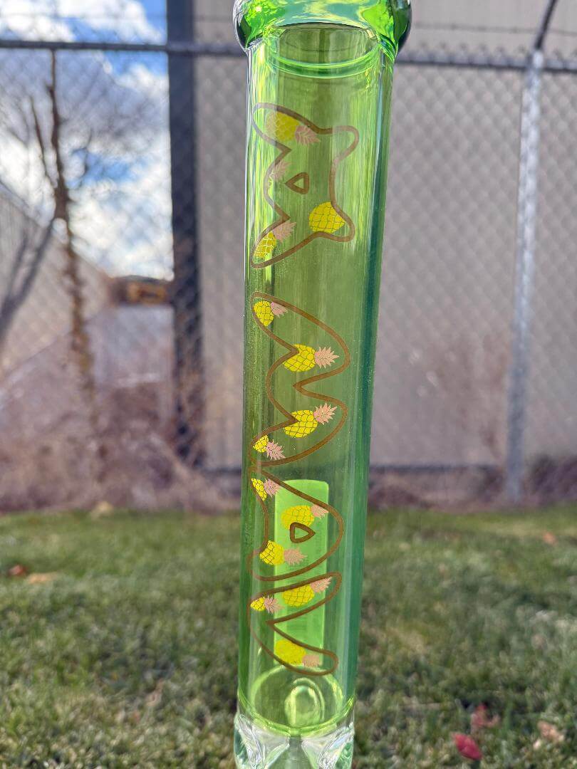 MAV Glass 18" Beaker - Ooze Pineapple with vibrant green and yellow design on durable borosilicate glass.
