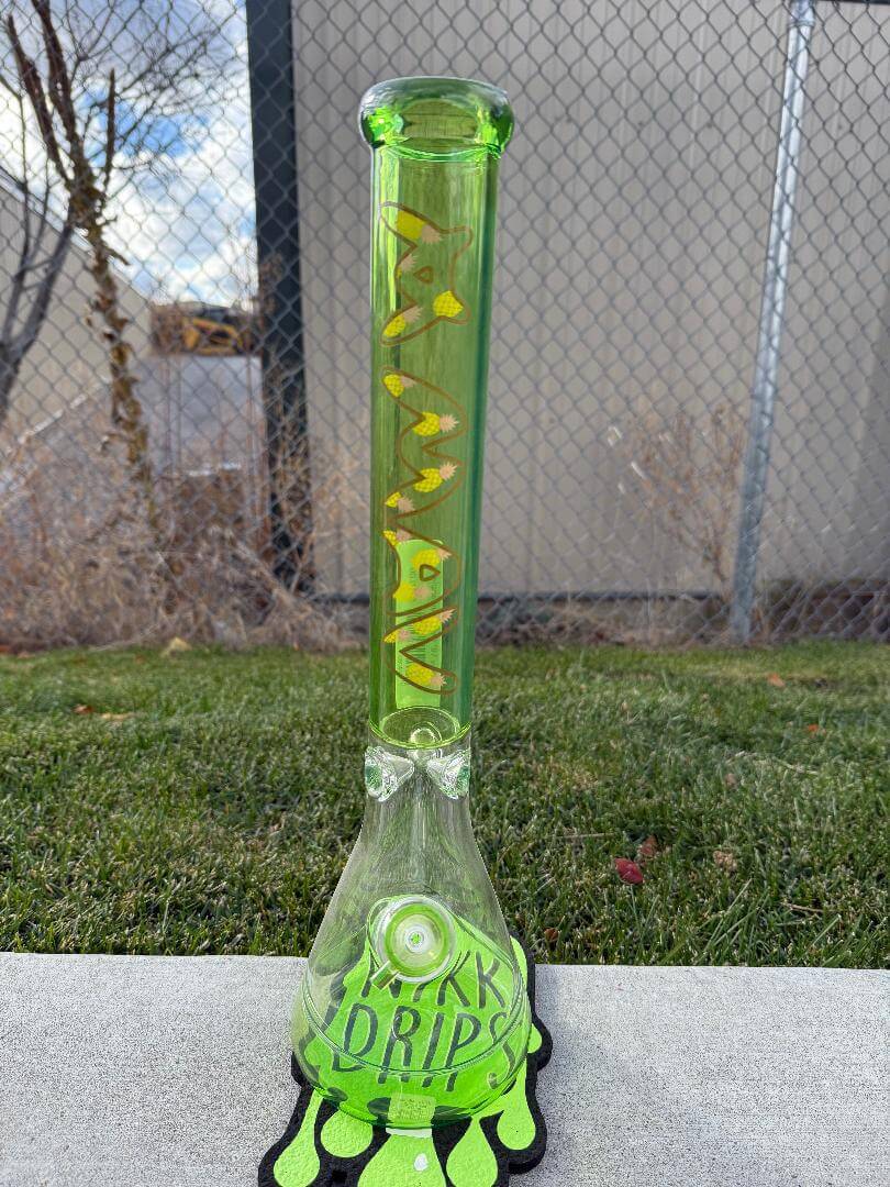 MAV Glass 18" Beaker - Ooze Pineapple featuring vibrant green and yellow design on durable borosilicate glass.