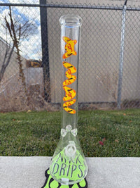 MAV Glass 18" Beaker 14mm 45° - Pineapple Lobster Beaker showcasing bright design in a grassy area.