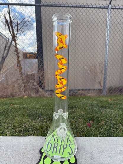 MAV Glass 18" Beaker 14mm 45° - Pineapple Lobster Beaker showcasing bright design in a grassy area.