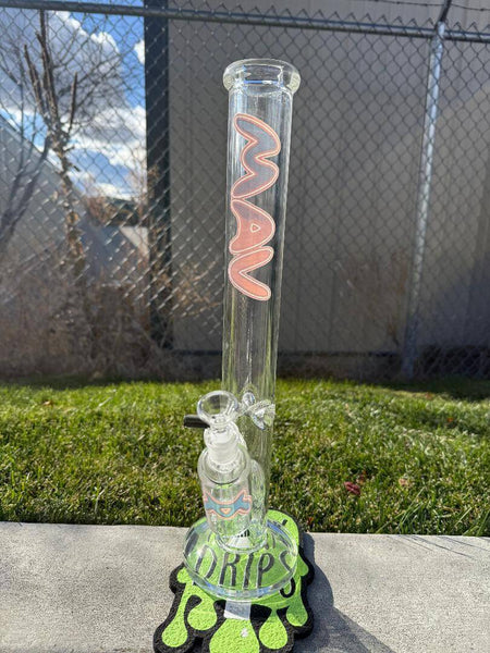 MAV Glass 18" Straight Tube Ash Catcher Combo 14mm 45° displayed outdoors on a colorful mat, showcasing its design and quality.