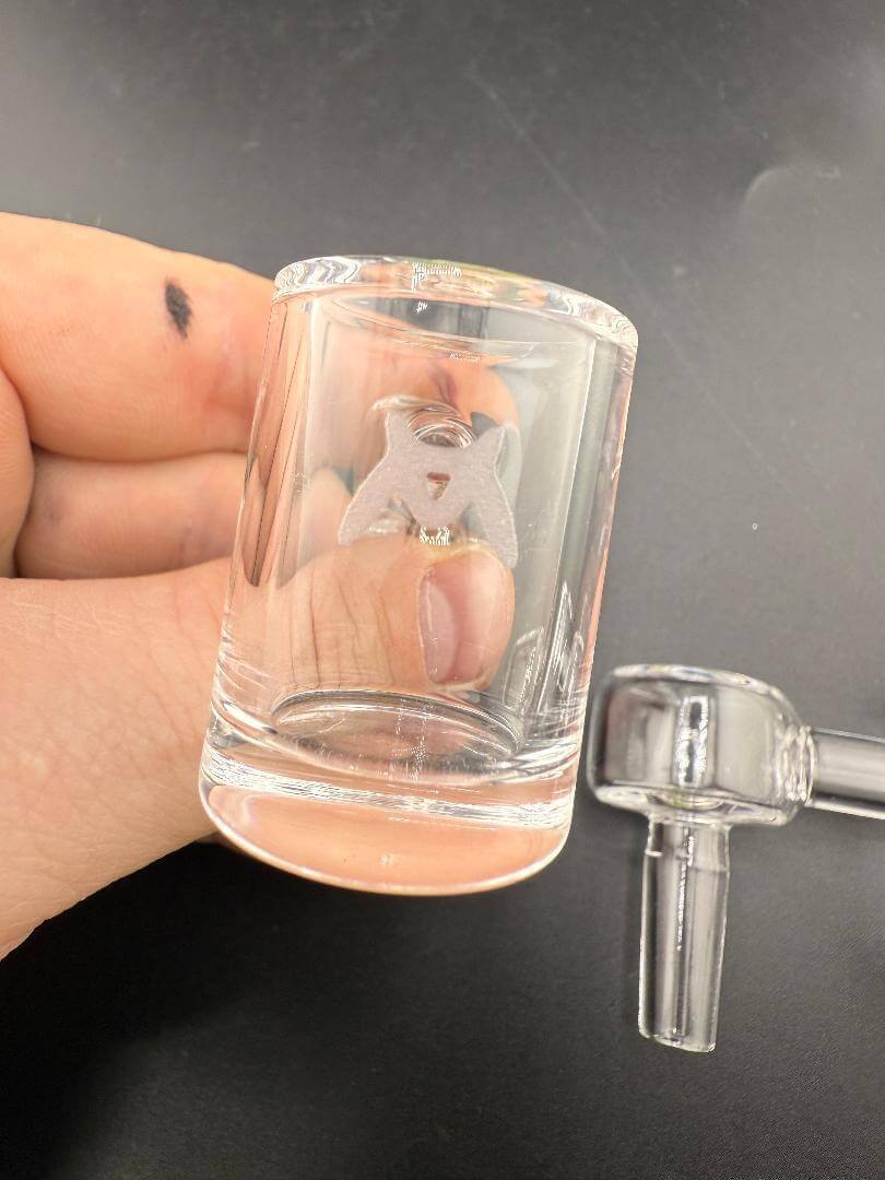 MAV Glass Quartz Banger - 10mm 90° Male Flat or Round Bottom shown in hand with clear design.