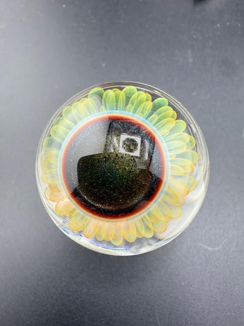 McDoogIe Glass Marble – 36mm Gold Fume Implosion with vibrant colors and intricate implosion pattern.