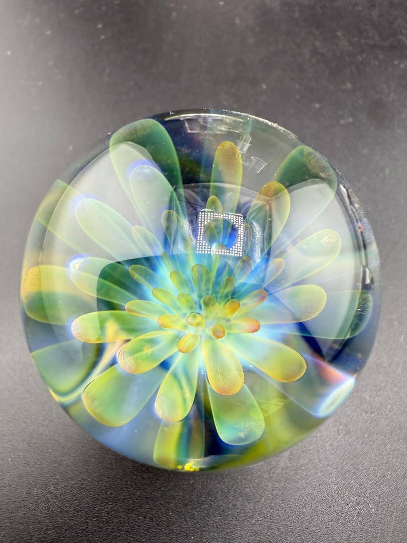 McDoogIe Glass Marble – 40mm Gold Fume Implosion showcasing vibrant colors and detailed craftsmanship.