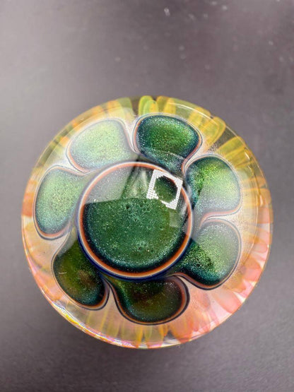 McDoogIe Glass Marble – 42mm Gold Fume Implosion showcasing vibrant colors and intricate design.