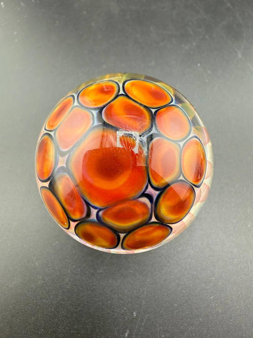 McDoogIe Glass Marble – 45mm Gold Fume Implosion showcasing deep colors and intricate design.