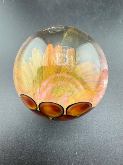 McDoogIe Glass Marble – 45mm Gold Fume Implosion showcasing colorful layers and detailed craftsmanship.