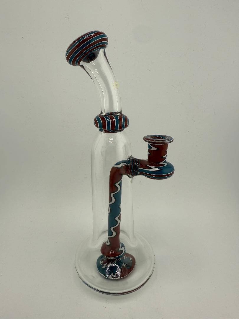 Mcdoogle Glass Clear Grateful Dead Worked Rig in red, white, and blue with intricate detailing, highlighting handcrafted artistry.