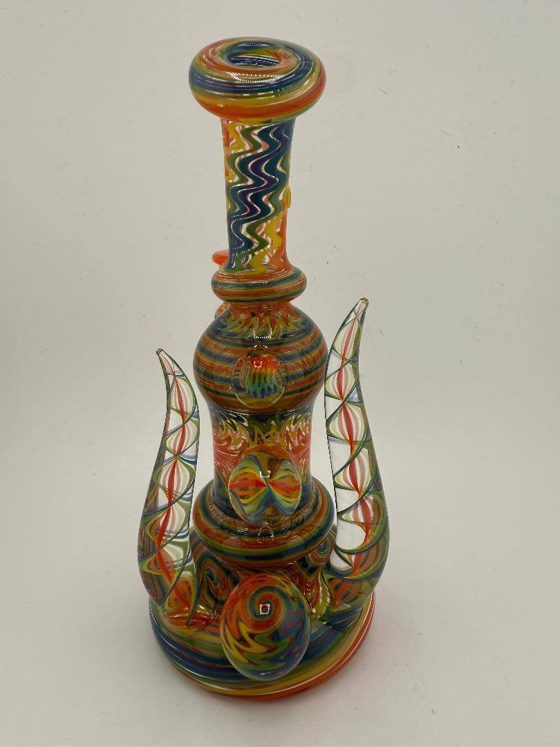Mcdoogle Glass Fully Worked Rainbow Wig Wag Rig in vibrant colors, featuring intricate wig wag patterns and a 10mm 90° design.