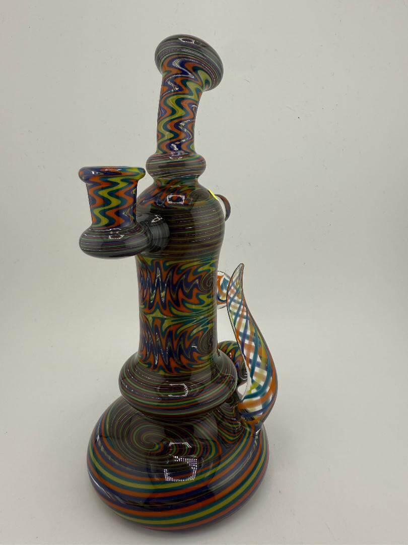 Mcdoogle Glass Fully Worked Wig Wag Rig in vibrant teal, yellow, and orange, 10mm 90°, showcasing intricate design.
