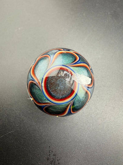 Mcdoogle Glass Marble - 31mm Fume Implosion showcasing vibrant colors and intricate depth, handcrafted in Spokane.
