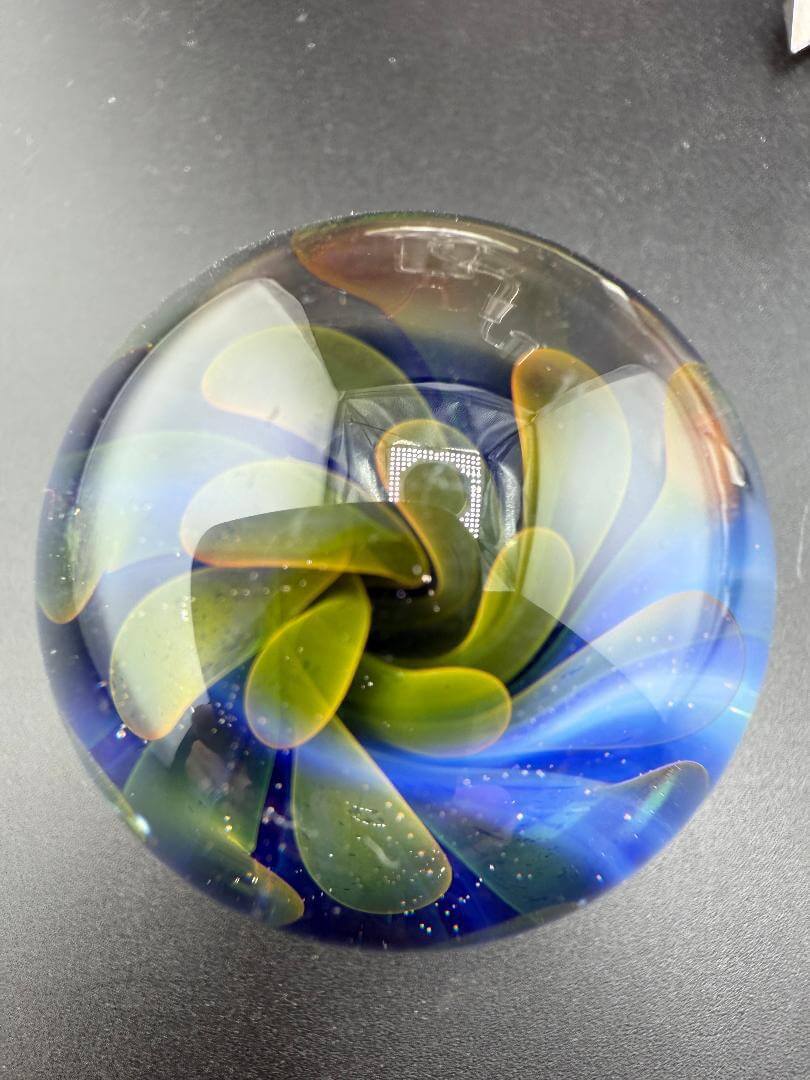 McDoogle Glass Marble – 40mm Gold Fume Implosion showcasing vibrant colors and layered patterns.