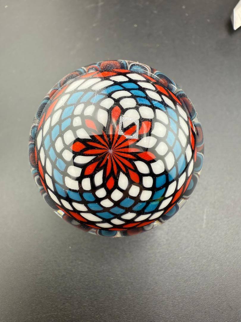 Mcdoogle Glass Marble - 41mm Red White & Blue Implosion & Fillacello, vibrant with red, white, and blue design.