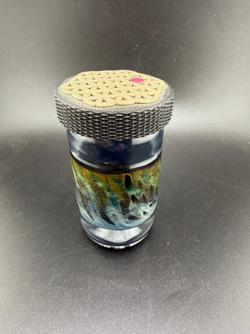 McDoogle Glass Nug Jar with Seed of Life lid, handcrafted borosilicate storage jar in vibrant colors.