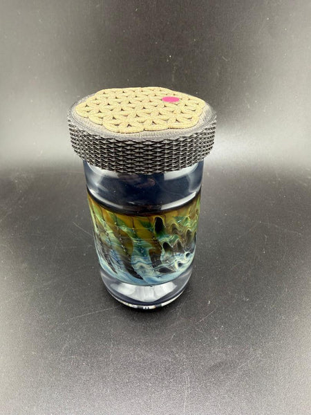 McDoogle Glass Nug Jar with Seed of Life lid, handcrafted borosilicate storage jar in vibrant colors.