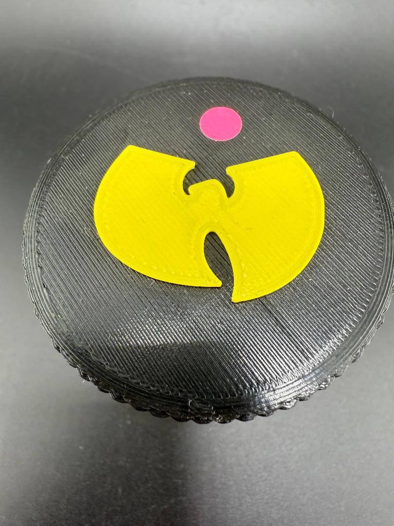 McDoogle Glass Nug Jar Wu-Tang Edition with iconic yellow Wu-Tang logo on a black background.