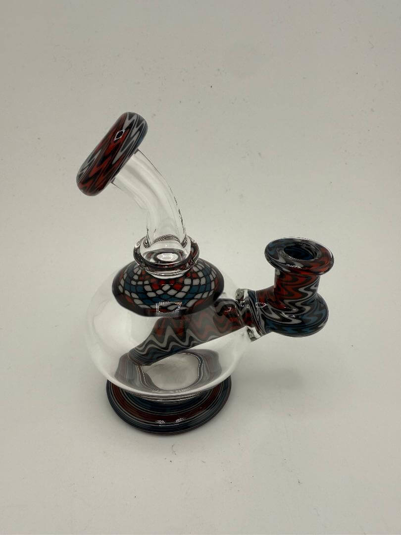 Mcdoogle Glass Orb Rig with colorful line work accents, 10mm and 90° design, showcasing handblown artistry.