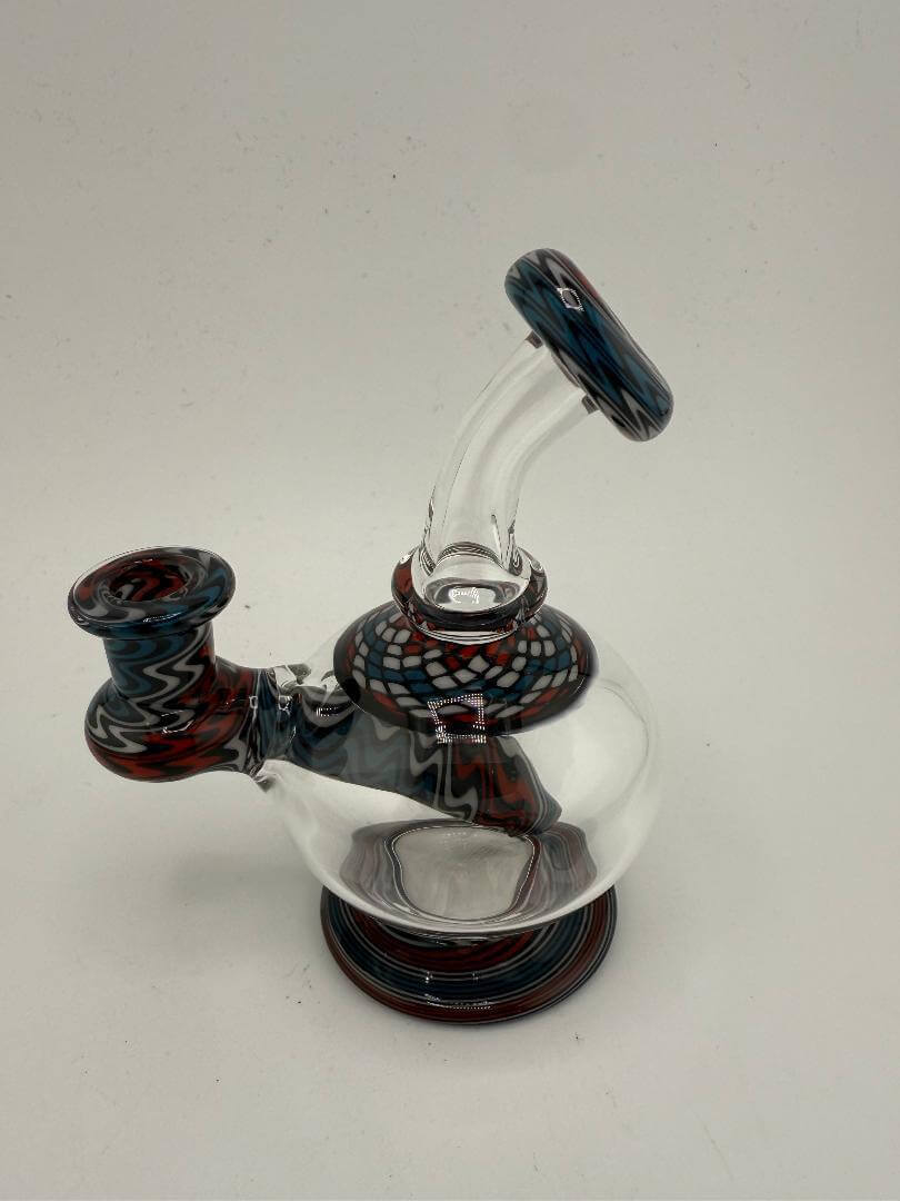 Mcdoogle Glass Orb Rig with vibrant line work accents, 10mm 90°, compact and handblown art piece.