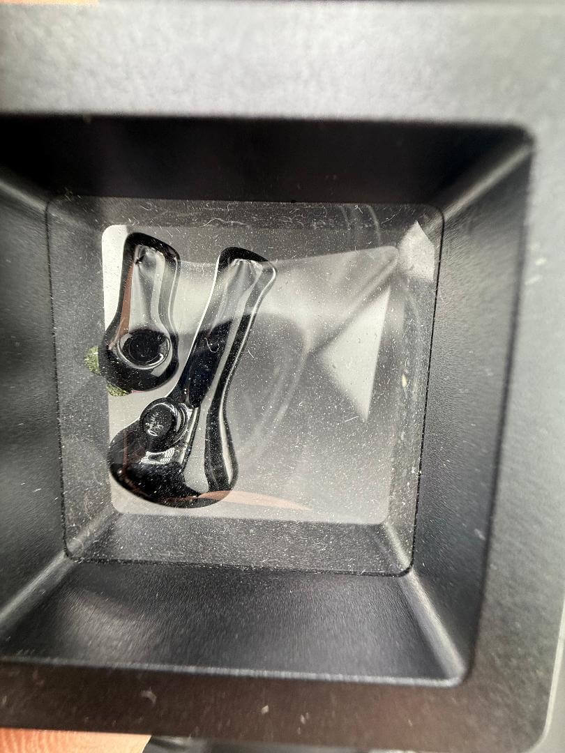 Close-up view of Paulson Pieces Miniature Surprise Beaker / Flower Pipe inside a display case.