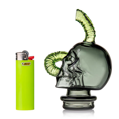 MJ Arsenal Grim Ripper Puffco Peak Top- Skull & Worm next to a green Bic lighter for scale