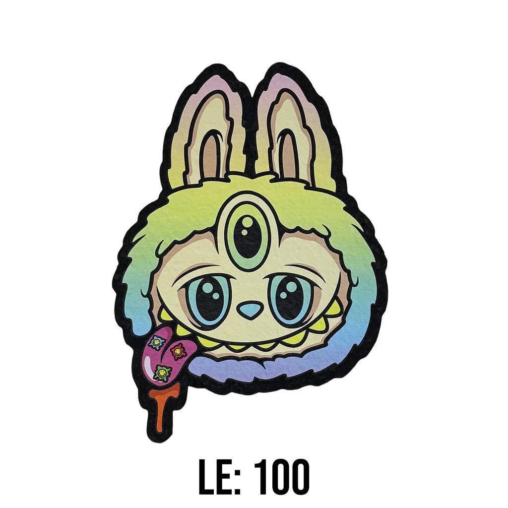 Moodmats  x Born ready Designs Lamumu Blind Bag Psyched Series Limited Edition mat with rainbow colors and a cute creature design.