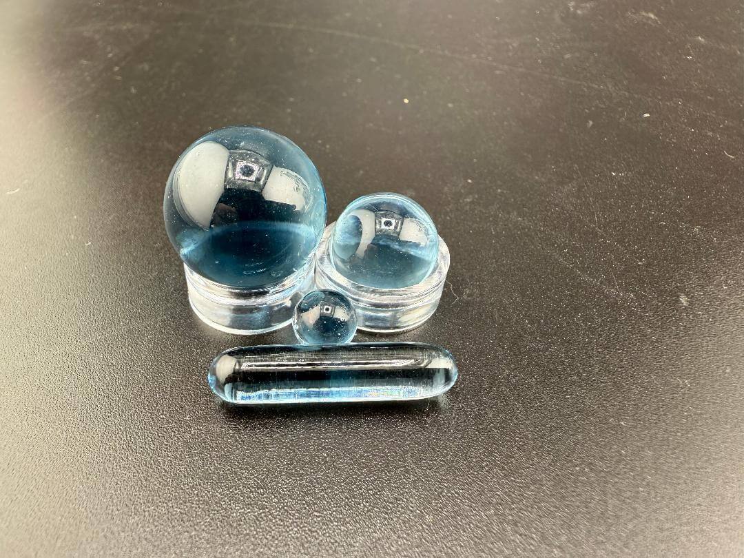 Mop Head Glass Slurper Quartz Terp Pearl Set featuring three artisan glass pieces in shades of blue.