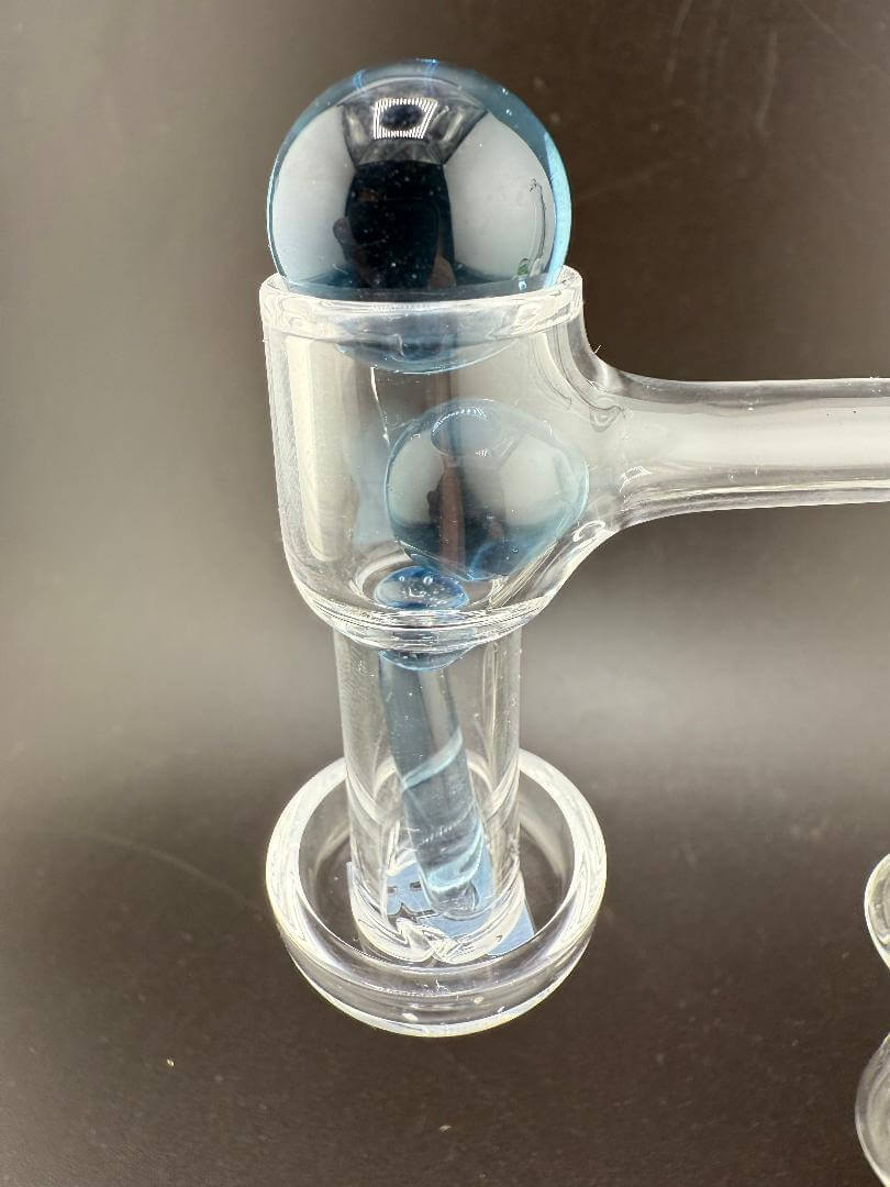 Close-up of Mop Head Glass Slurper with blue terp pearls for enhanced dabbing experience.