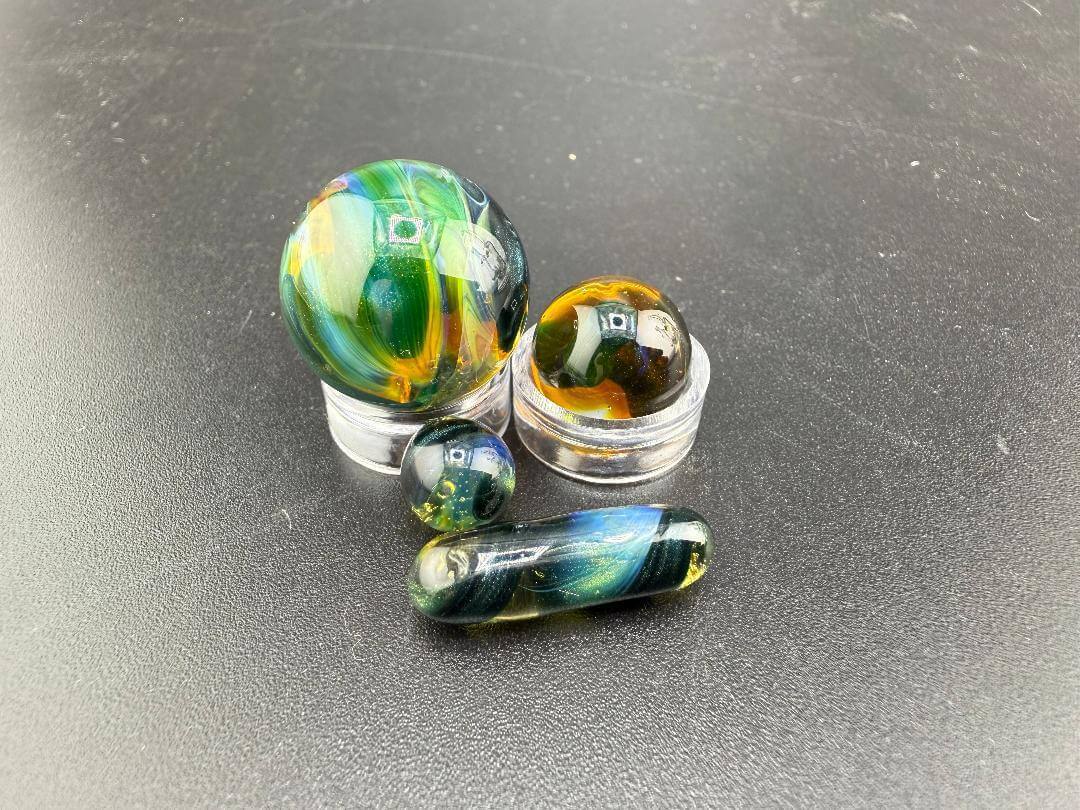 Mop Head Glass Slurper Quartz Terp Pearl Set featuring colorful, handcrafted glass pearls on a black surface.