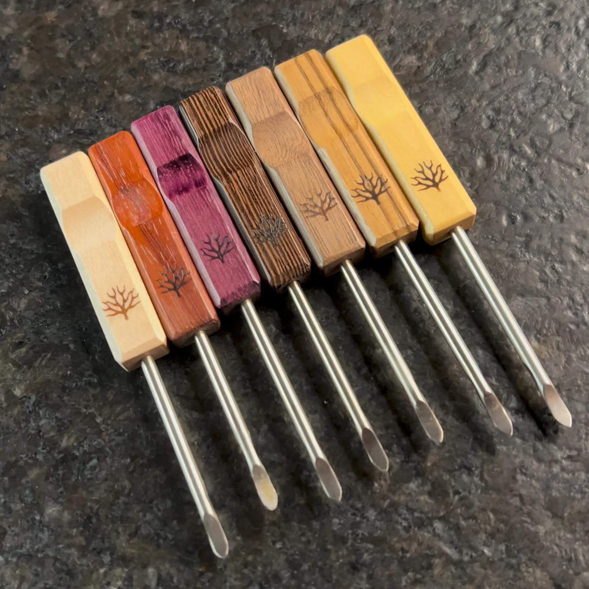 Mystic Timber Dab Tool - Pocket Pick set of seven colorful dabbers with wood handles and stainless steel tips.