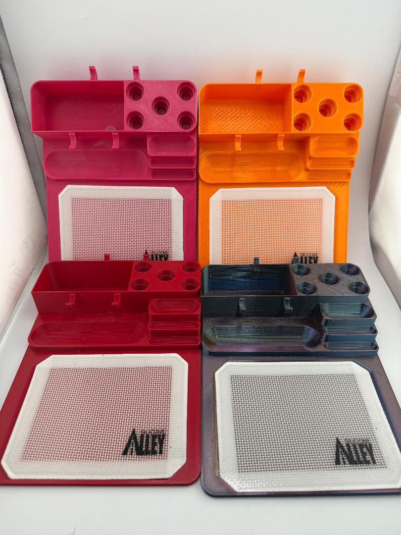 Nikk Drips 3D Printed Dab Station in various colors with slots for bangers and tools, perfect for organized dabbing.