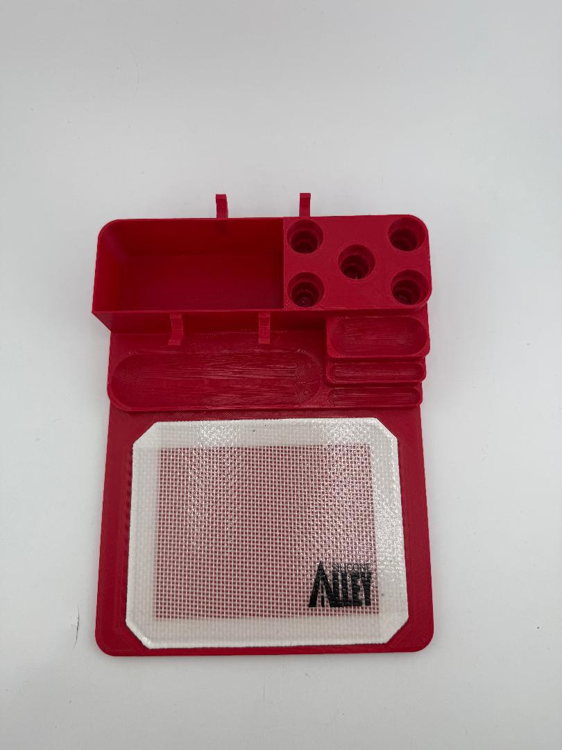 Nikk Drips 3D Printed Dab Station in red, featuring tool slots and a silicone slick work area for dabbing efficiency.