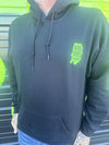 Nikk Drips Hoodie featuring a black design and vibrant green logo on a person, showcasing street-ready style.
