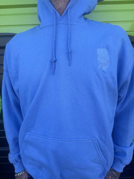 Nikk Drips Hoodie in light blue, showcasing heavy blend comfort and stylish street-ready design.