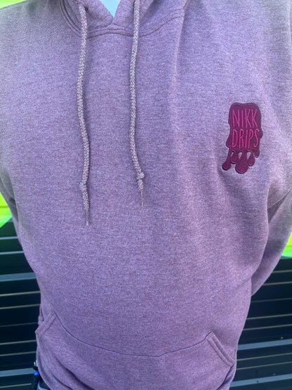 Nikk Drips Hoodie in a cozy heather purple with embroidered logo, perfect for street-ready style.